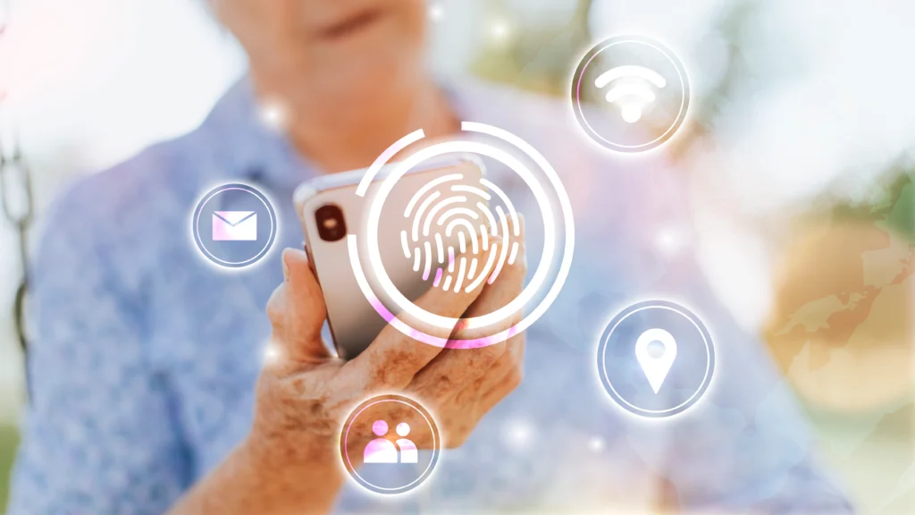 essoa segurando um smartphone, com ícones digitais sobrepostos representando impressão digital, localização, e-mail, conexão Wi-Fi e contatos, simbolizando o uso e monitoramento de dados pessoais.